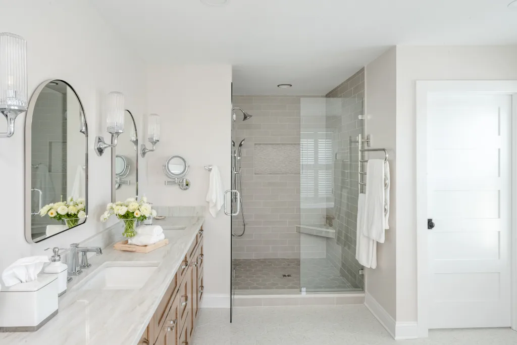 Master bathroom vanity with glass walk-in shower and hex tile floor in Charleston, SC
