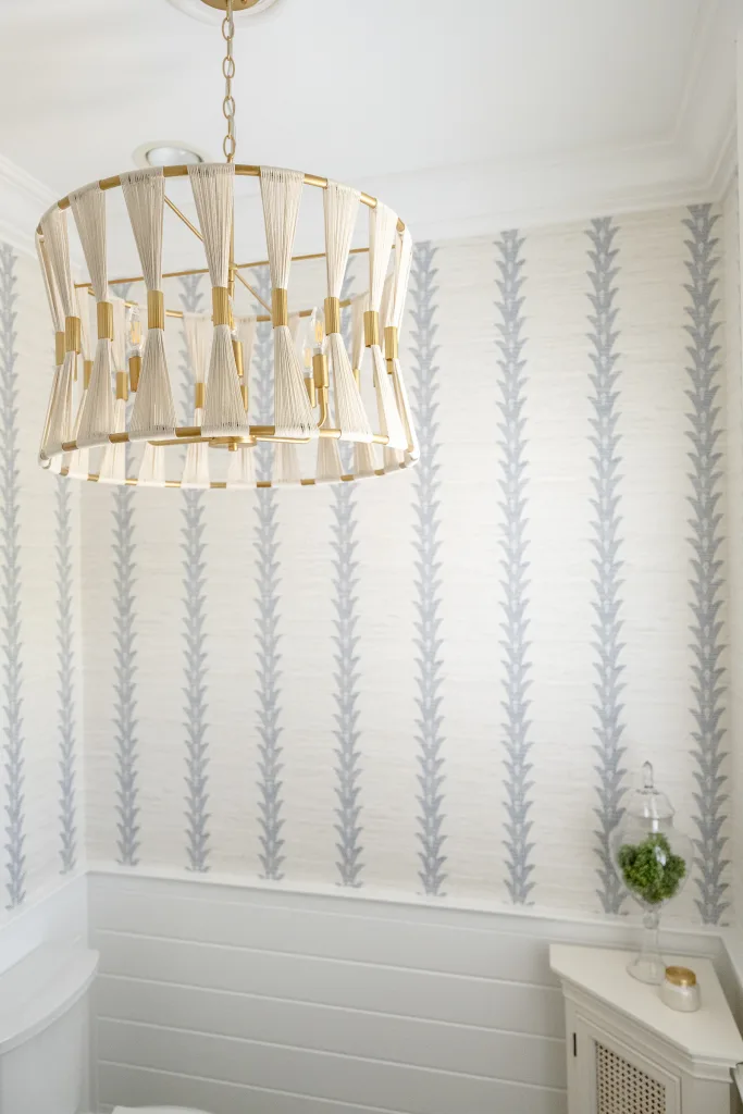 Brass and rope drum chandelier in a powder room with striped grasscloth wallpaper, Charleston, SC